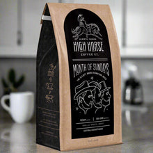 Load image into Gallery viewer, medium roast coffee beans called month f sundays. the elliot brood signature blend by high horse coffee co. made in alberta.