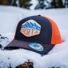 Load image into Gallery viewer, berta hat with mountains in blue and orange
