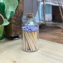 Load image into Gallery viewer, tiny jar of purple matches with striker on bottom
