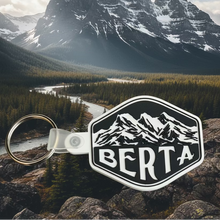 Load image into Gallery viewer, Keychain with 'Berta' logo and 3 sisters mountains
