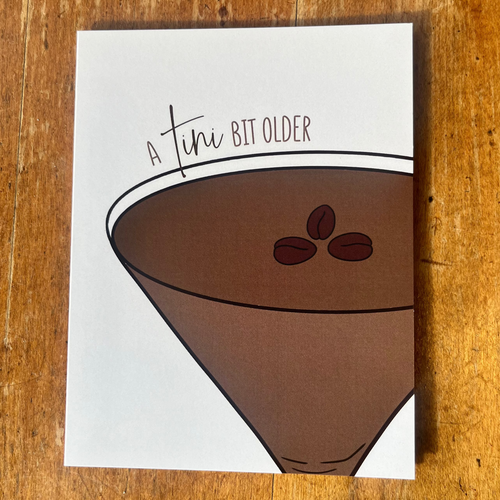 Note card with an espresso martini design and text 'A tiny bit older' 