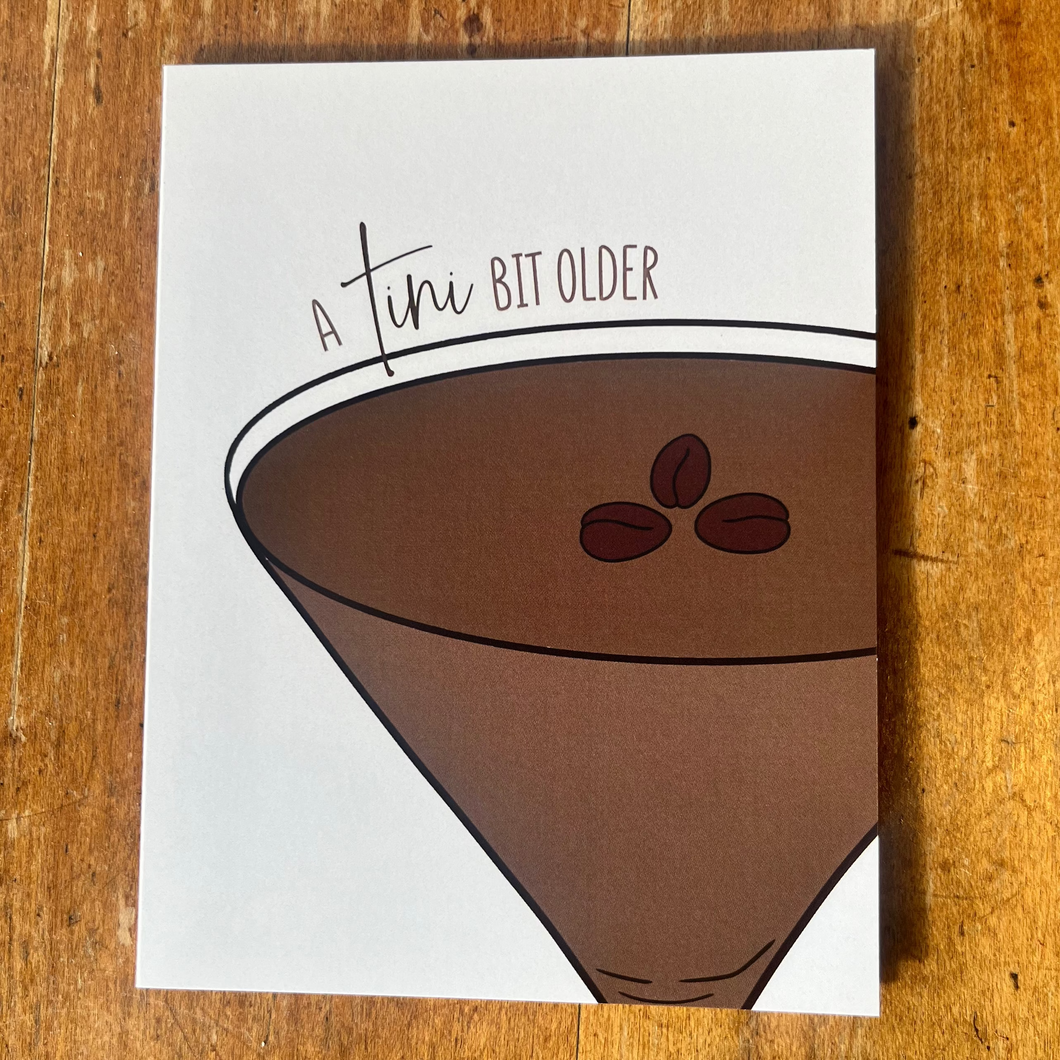 Note card with an espresso martini design and text 'A tiny bit older' 