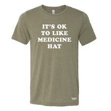 Load image into Gallery viewer, it&#39;s okay to like medicine hat tshirt in army green. made in medicine hat alberta.
