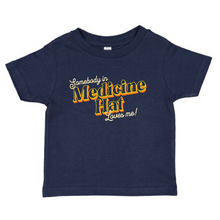 Load image into Gallery viewer, somebody in medicine hat loves me tshirt toddler size.
