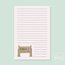Load image into Gallery viewer, notepad with the welcome to alberta wild rose country sign
