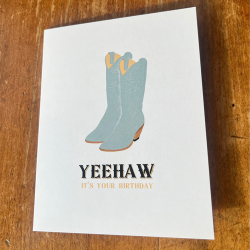 Greeting card with blue cowboy boots and 'Yeehaw It's Your Birthday' text 